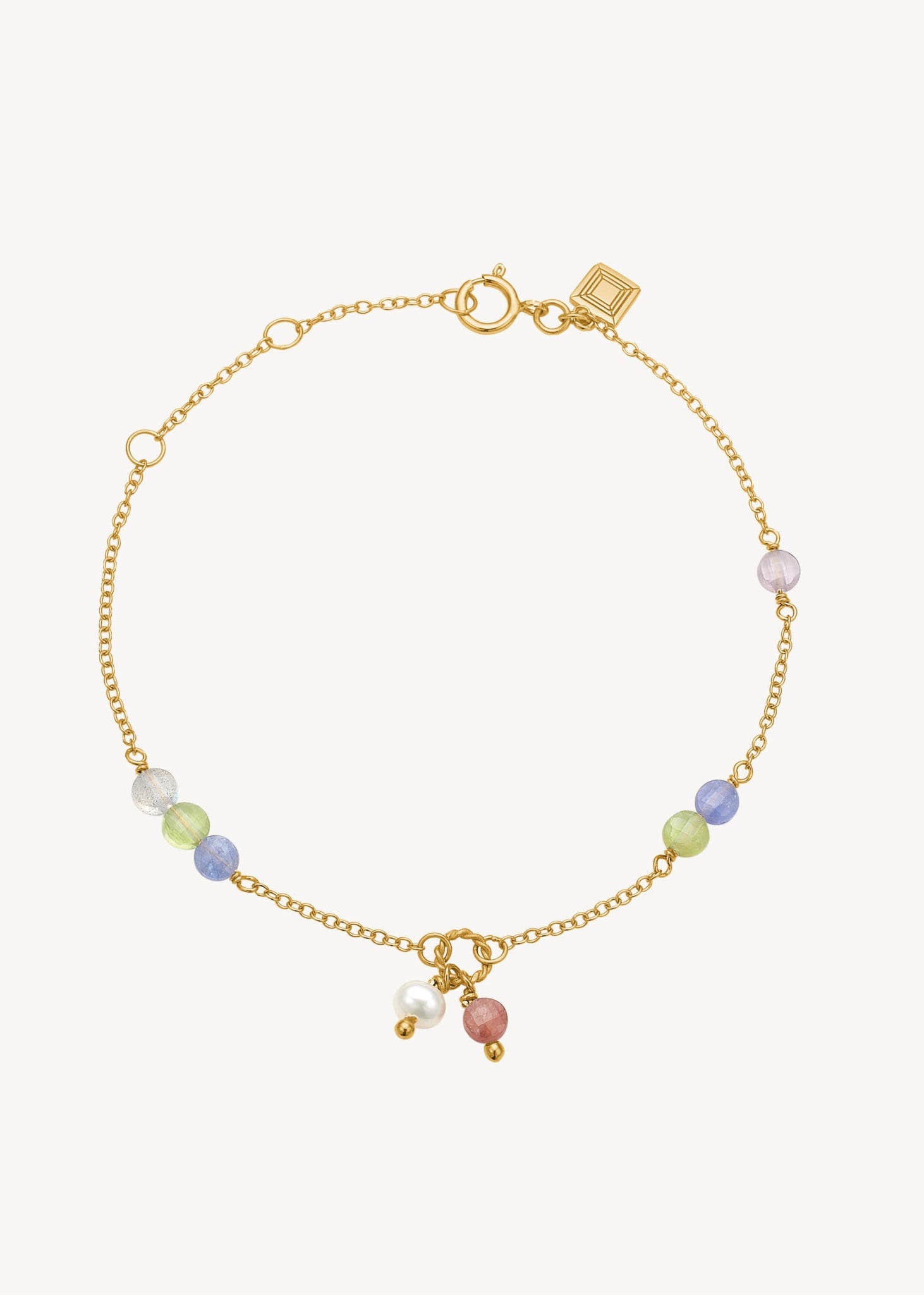 farverigt ædelstens armbånd i guld med blandede pastel ædelsten, tanzanit, pink spinel, ferskvandsperle og labradorit ædelsten til hende