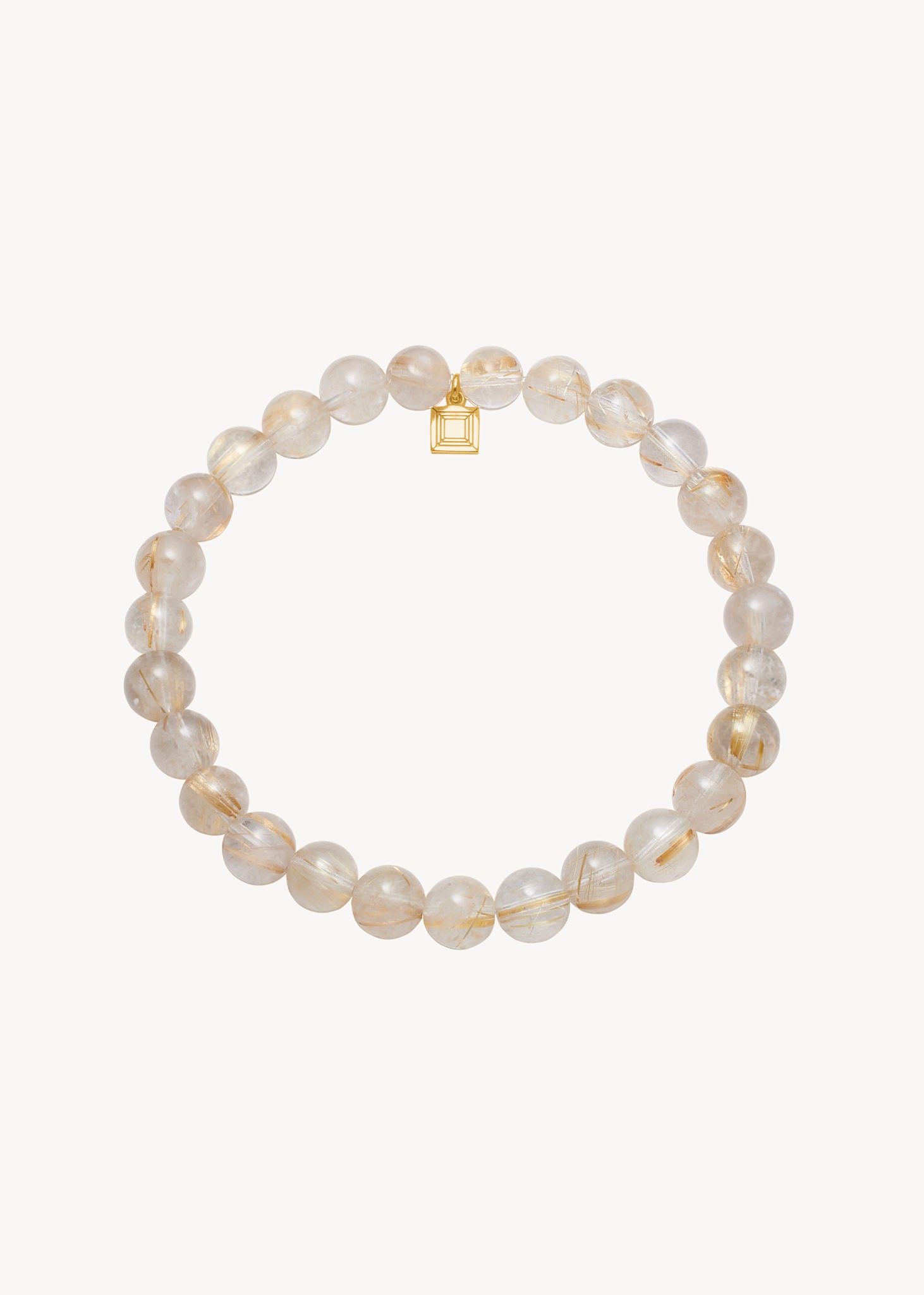 elegant slip-on armbånd til kvinder med gyldne rutil kvarts ædelsten i rund slibning med elastik snor og guldbelagt sølv tag med carré logo