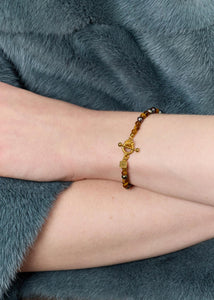 Uma armband med Påfågelfjäderpärlor och Tigeröga - guldpläterad