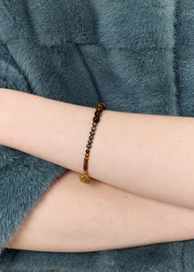 Dani armband med Påfågelfjädrar och Tigeröga - guldpläterad